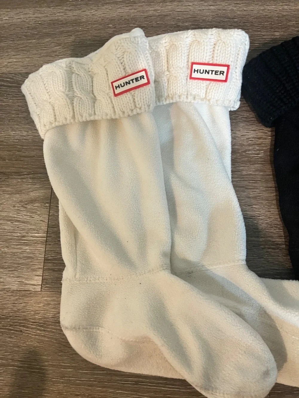 Women’s tall black hunter boots with socks
